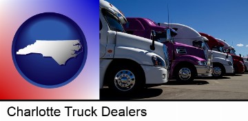 row of semi trucks at a truck dealership in Charlotte, NC