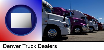 row of semi trucks at a truck dealership in Denver, CO