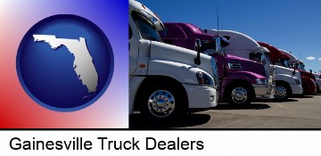 row of semi trucks at a truck dealership in Gainesville, FL