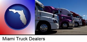 row of semi trucks at a truck dealership in Miami, FL