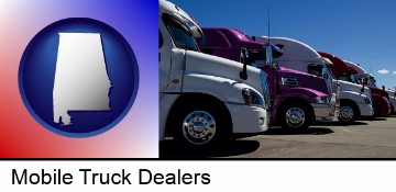 row of semi trucks at a truck dealership in Mobile, AL