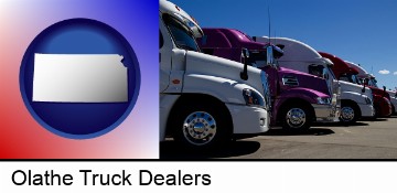 row of semi trucks at a truck dealership in Olathe, KS