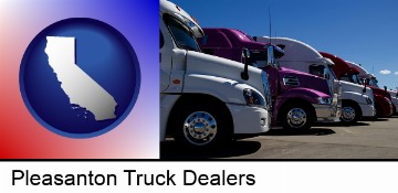 row of semi trucks at a truck dealership in Pleasanton, CA