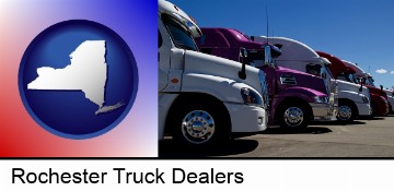 row of semi trucks at a truck dealership in Rochester, NY