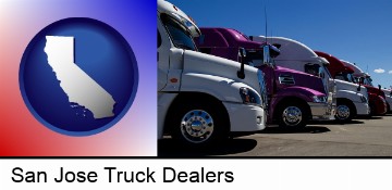 row of semi trucks at a truck dealership in San Jose, CA