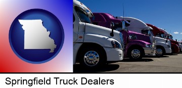 row of semi trucks at a truck dealership in Springfield, MO