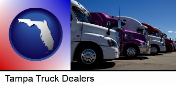 row of semi trucks at a truck dealership in Tampa, FL