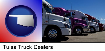 row of semi trucks at a truck dealership in Tulsa, OK