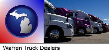 row of semi trucks at a truck dealership in Warren, MI
