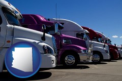 arizona map icon and row of semi trucks at a truck dealership