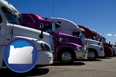 oregon map icon and row of semi trucks at a truck dealership