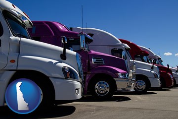 row of semi trucks at a truck dealership - with Delaware icon