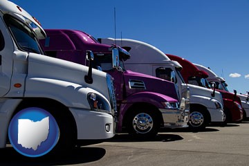 row of semi trucks at a truck dealership - with Ohio icon