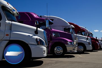 row of semi trucks at a truck dealership - with Tennessee icon
