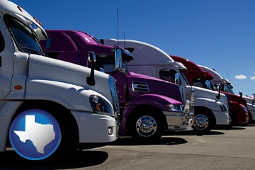 row of semi trucks at a truck dealership - with Texas icon