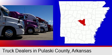 row of semi trucks at a truck dealership; Pulaski County highlighted in red on a map