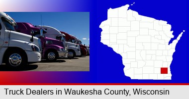 row of semi trucks at a truck dealership; Waukesha County highlighted in red on a map