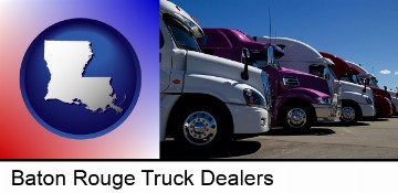 row of semi trucks at a truck dealership in Baton Rouge, LA