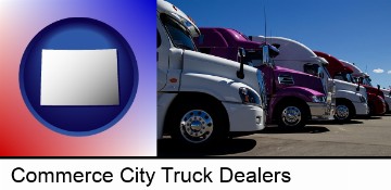 row of semi trucks at a truck dealership in Commerce City, CO
