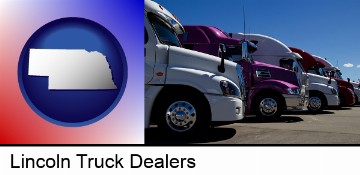 row of semi trucks at a truck dealership in Lincoln, NE