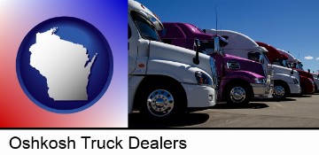 row of semi trucks at a truck dealership in Oshkosh, WI