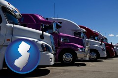 row of semi trucks at a truck dealership - with NJ icon