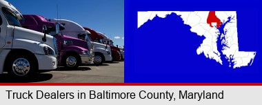 row of semi trucks at a truck dealership; Baltimore County highlighted in red on a map