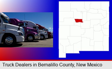 row of semi trucks at a truck dealership; Bernalillo County highlighted in red on a map