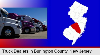 row of semi trucks at a truck dealership; Burlington County highlighted in red on a map