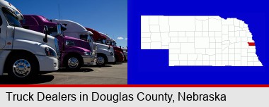 row of semi trucks at a truck dealership; Douglas County highlighted in red on a map