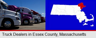 row of semi trucks at a truck dealership; Essex County highlighted in red on a map