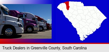 row of semi trucks at a truck dealership; Greenville County highlighted in red on a map