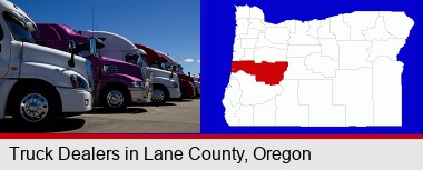 row of semi trucks at a truck dealership; Lane County highlighted in red on a map