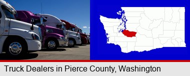 row of semi trucks at a truck dealership; Pierce County highlighted in red on a map