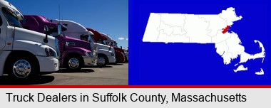 row of semi trucks at a truck dealership; Suffolk County highlighted in red on a map