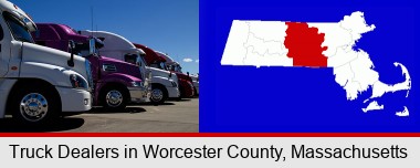 row of semi trucks at a truck dealership; Worcester County highlighted in red on a map